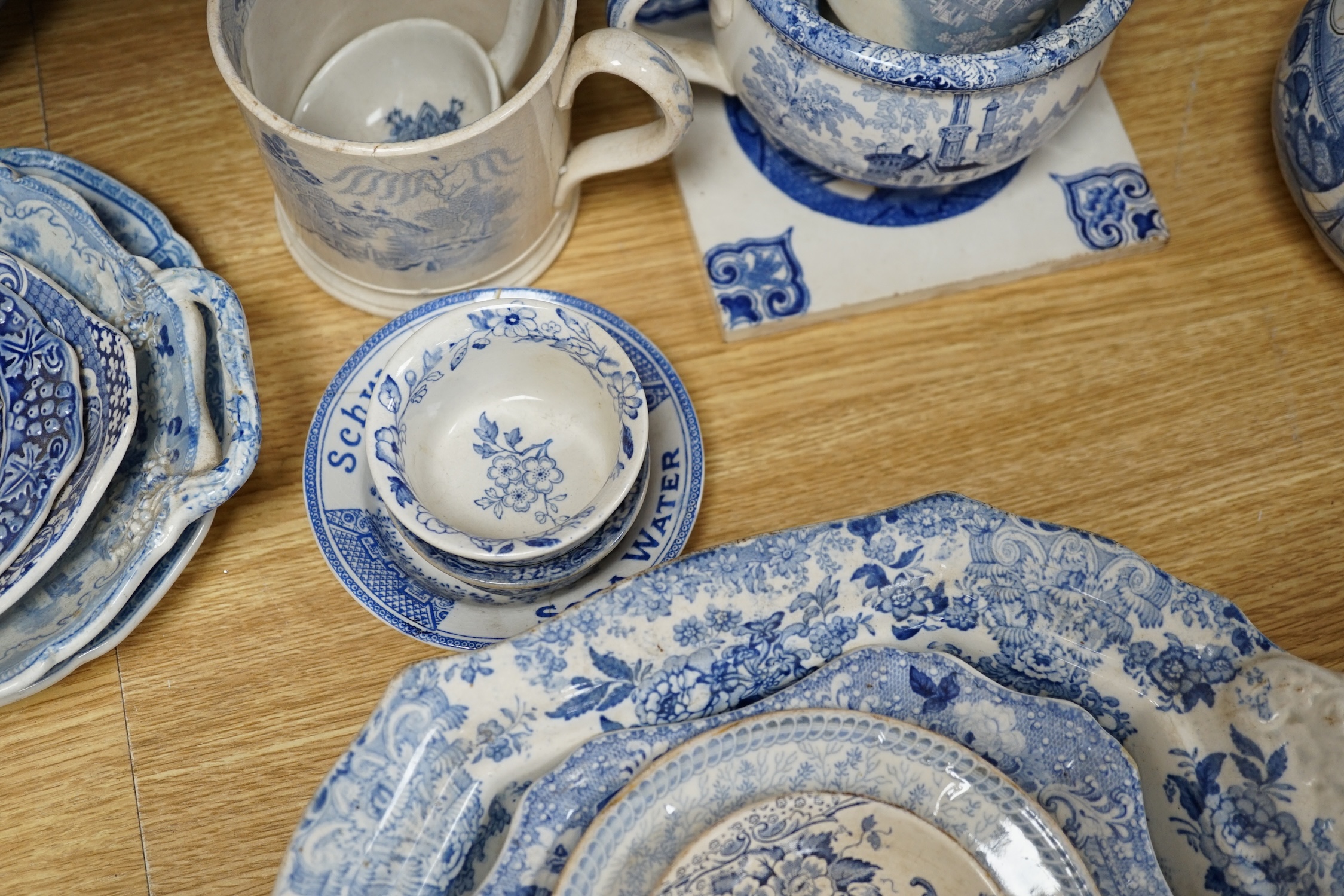 A collection of mixed blue and white dinnerware including Masons Ironstone, mostly plates and jugs. Condition - varies, poor to fair